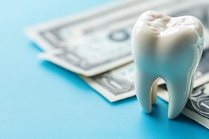 Money and an artificial tooth